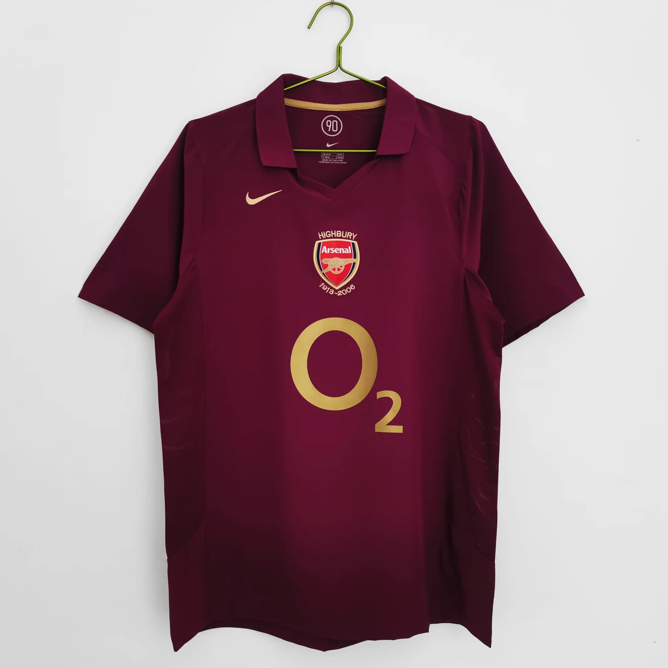 Maroon Arsenal sports jersey with Nike logo on a white background